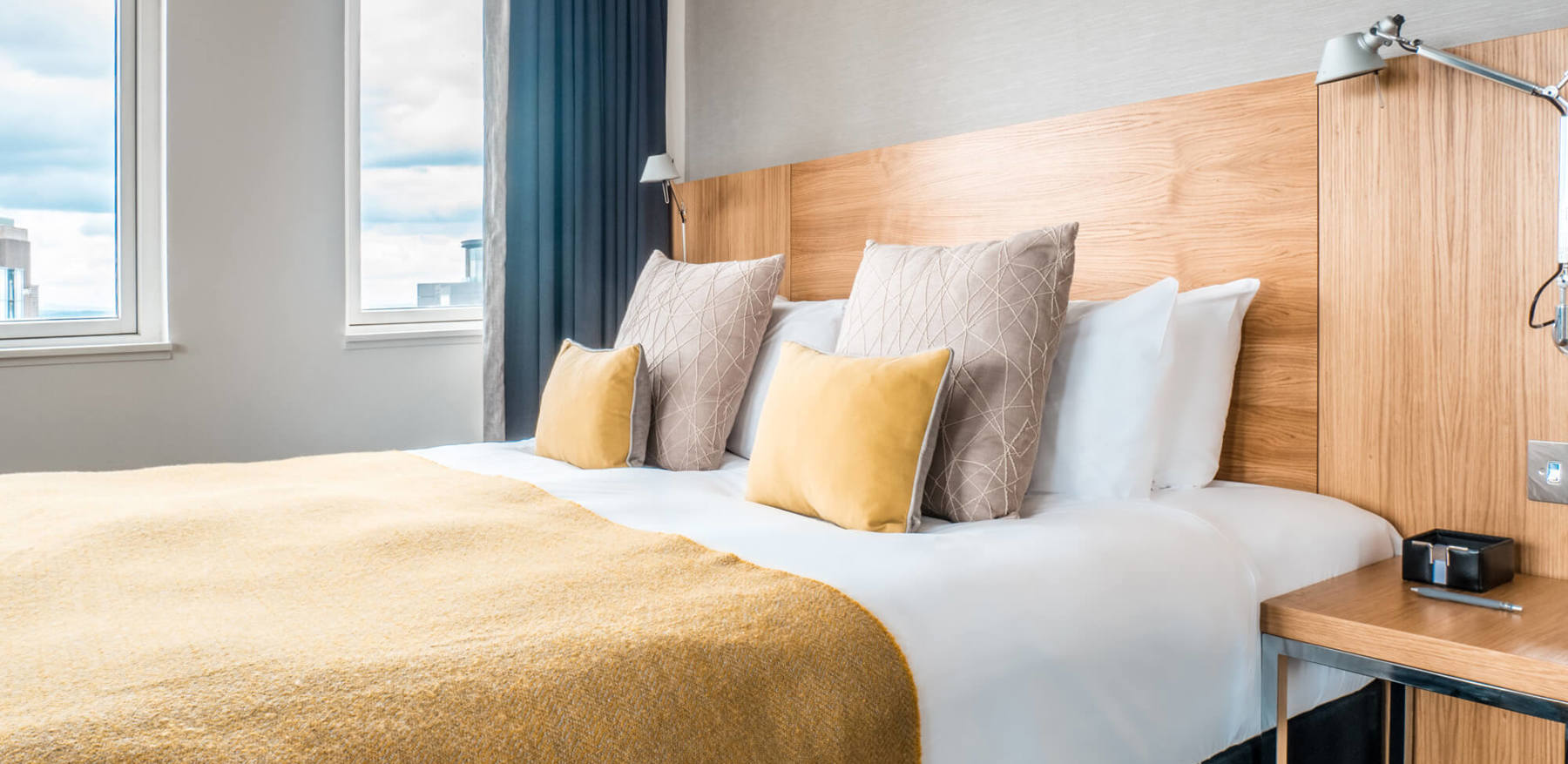 Deluxe Room with king-size bed and sofa at Apex Waterloo Place Hotel