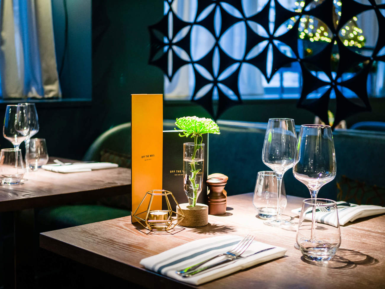 Dining table at Off The Wall Bar & Grill