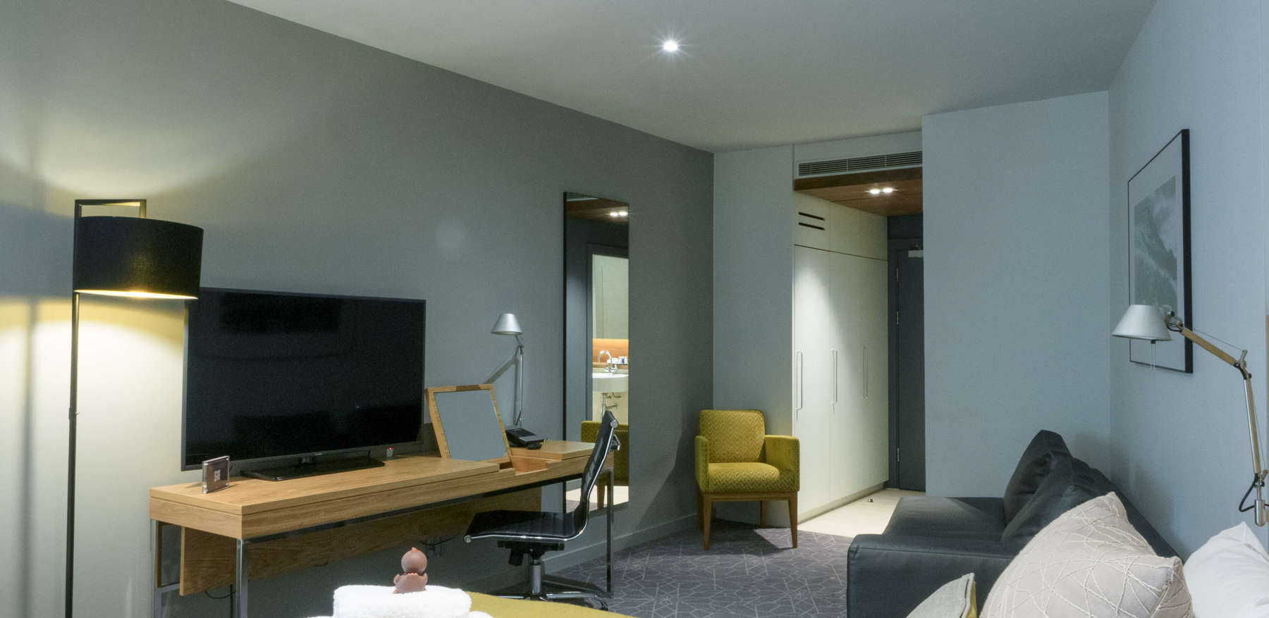 Family Room bed and tv at Apex Waterloo Place Hotel