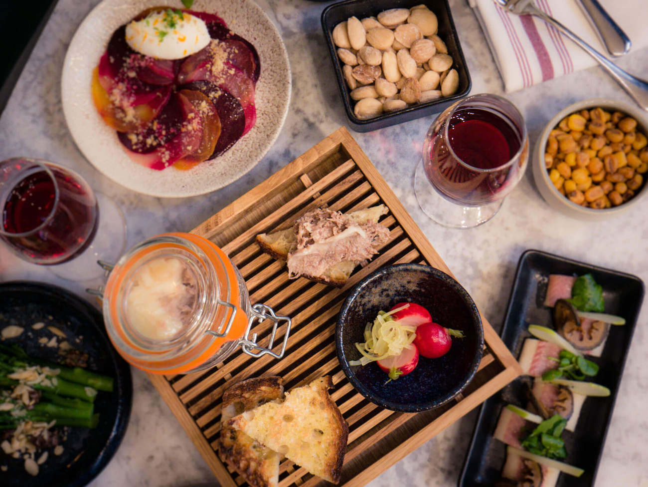 Flatlay of small plates and wine at Lazy Ballerinas wine bar