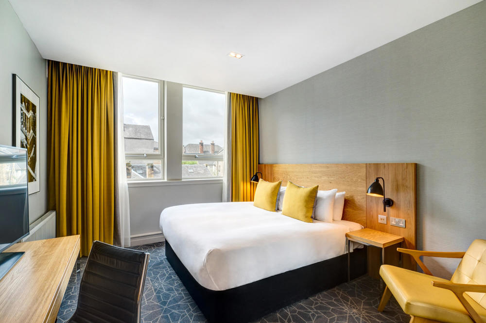 City Room with queen-size bed and desk at Apex Grassmarket Hotel