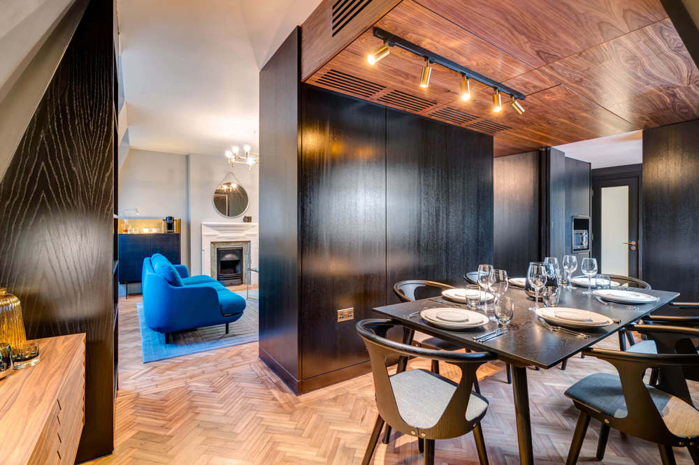 Dining area with table and chairs in Temple Suite at Apex Temple Court Hotel
