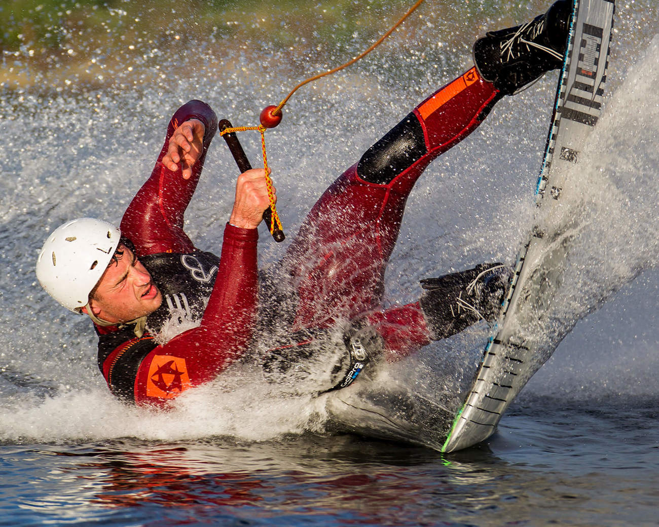Man waterskiing on lake