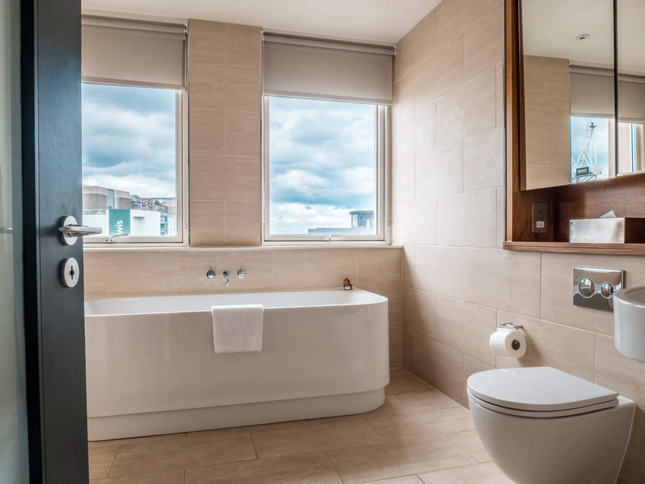 Freestanding bathtub in Deluxe Room at Apex Waterloo Place Hotel