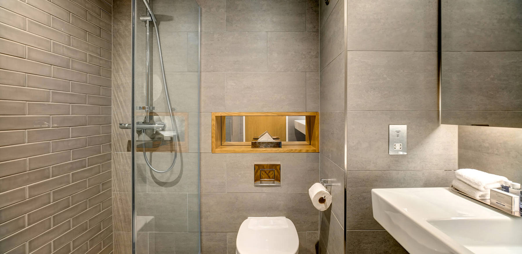 Standard Room bathroom with walk-in shower and sink