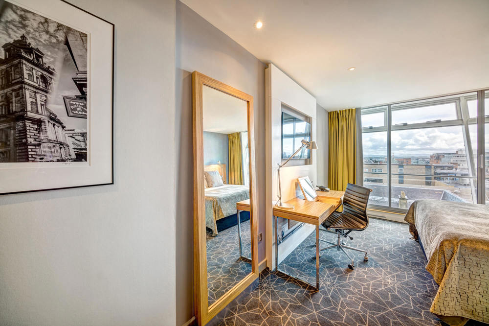 City View Room with bed, TV and desk