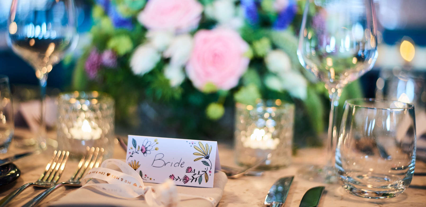 Wedding Table Setting With Place Card And Flowers