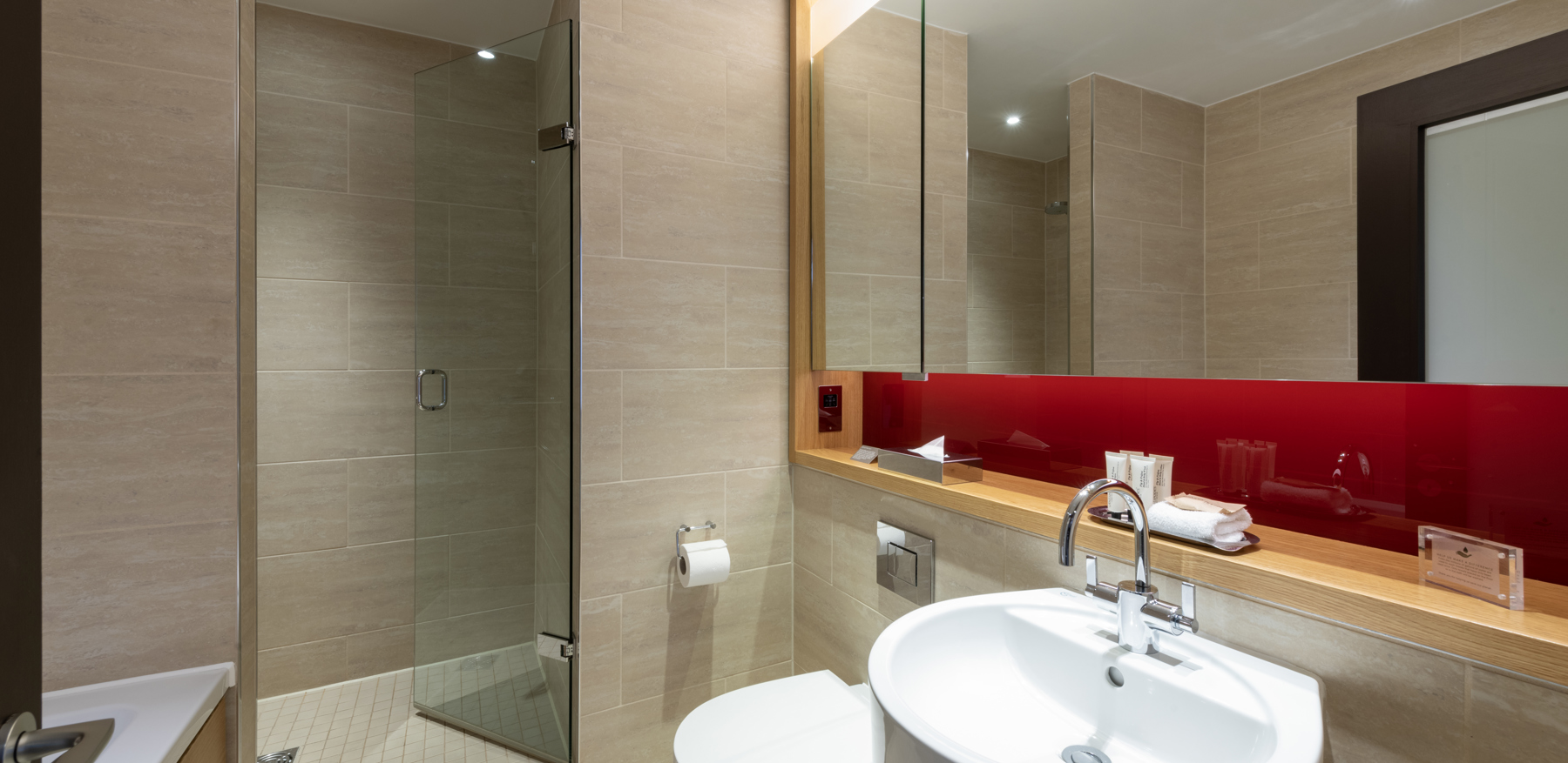 Deluxe Room bathroom with walk in shower at Apex Temple Court Hotel