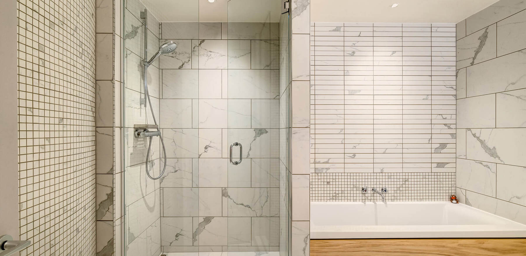 Duplex Suite bathroom with marble tiles, walk-in shower and bath at Apex Waterloo Place Hotel
