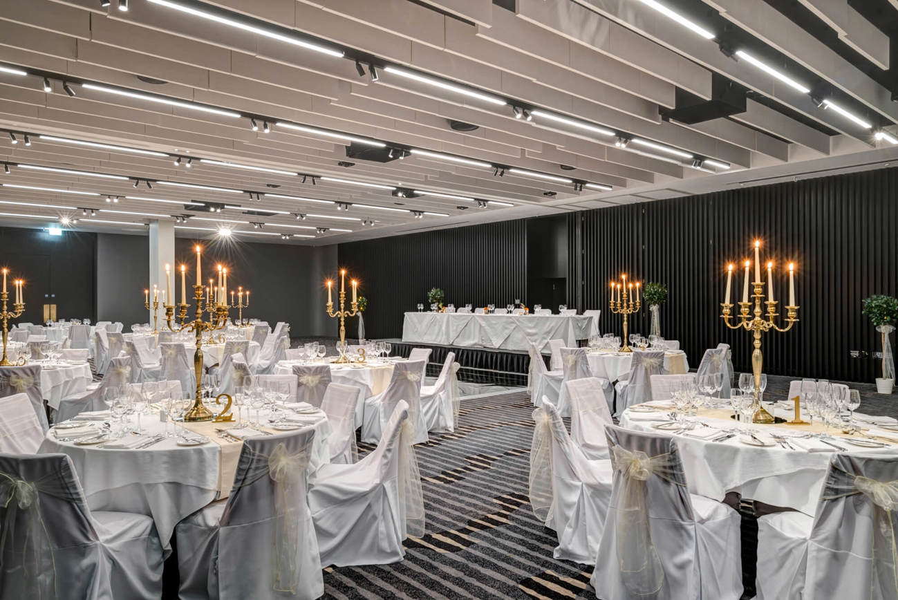 The Lansdown Suite set for wedding with white tablecloths and gold candles