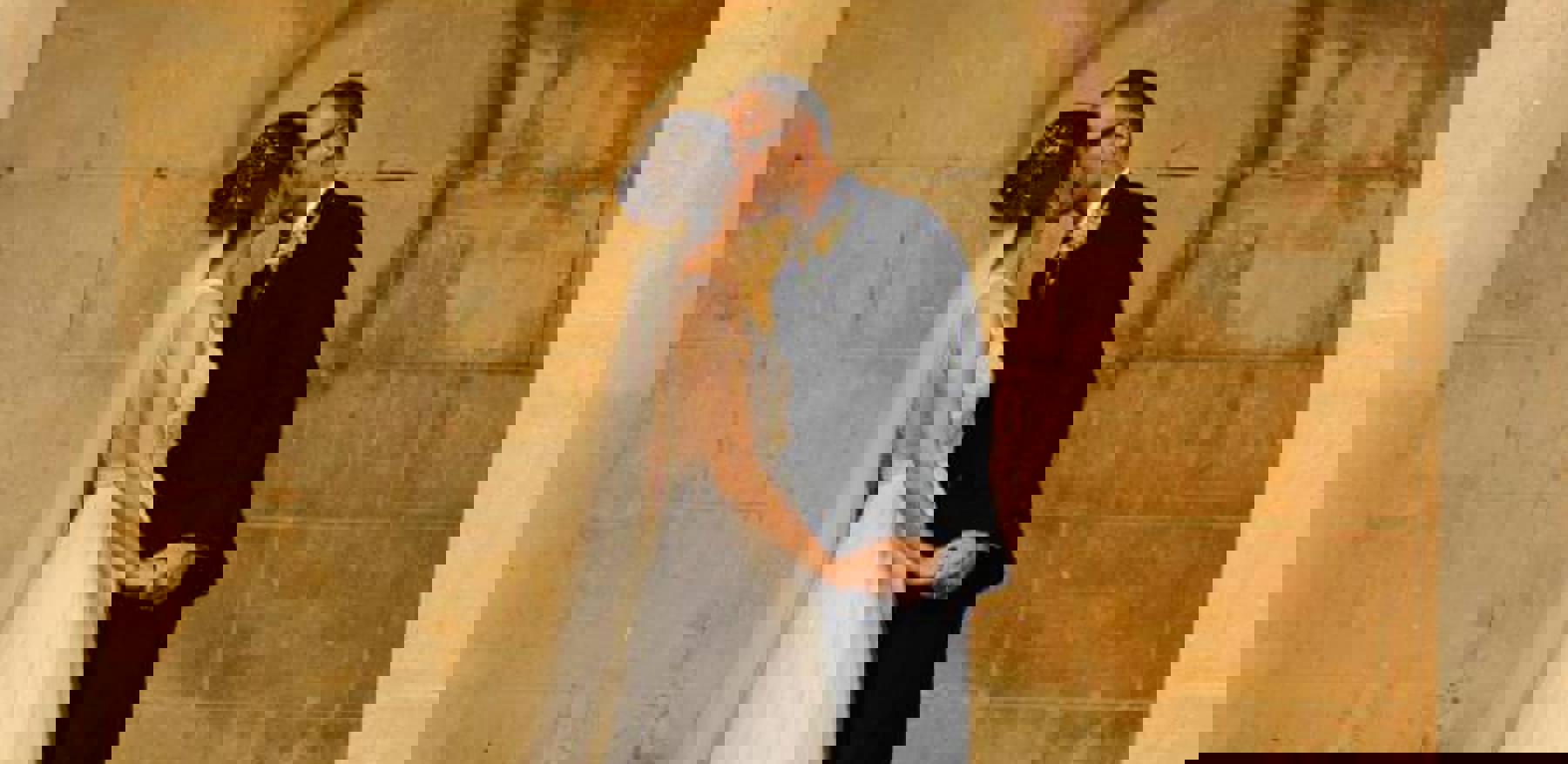 Couple Kissing In Front Of Old Style Building