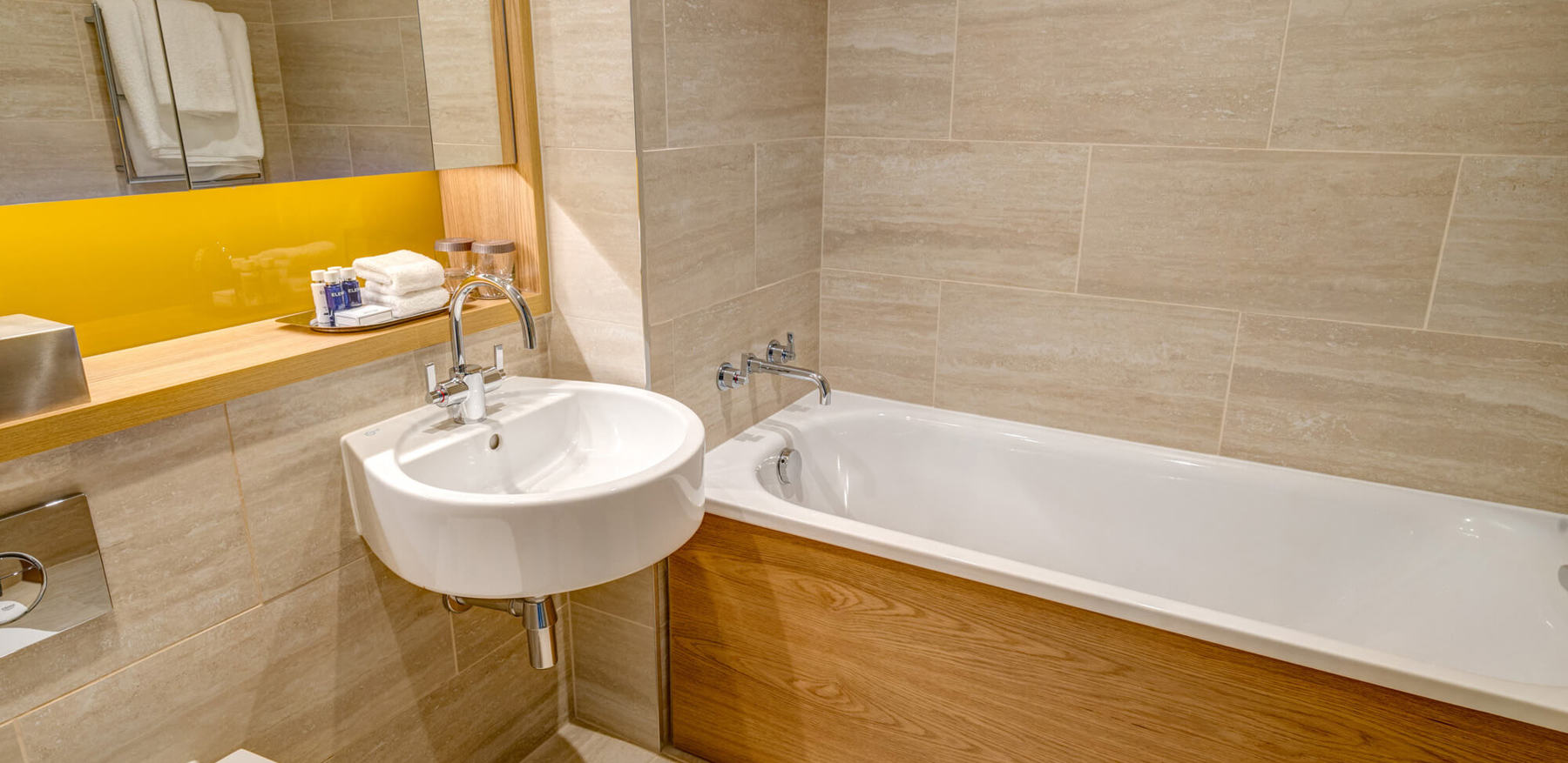 Castle View Deluxe Room with Balcony bathroom with bath at Apex Grassmarket Hotel