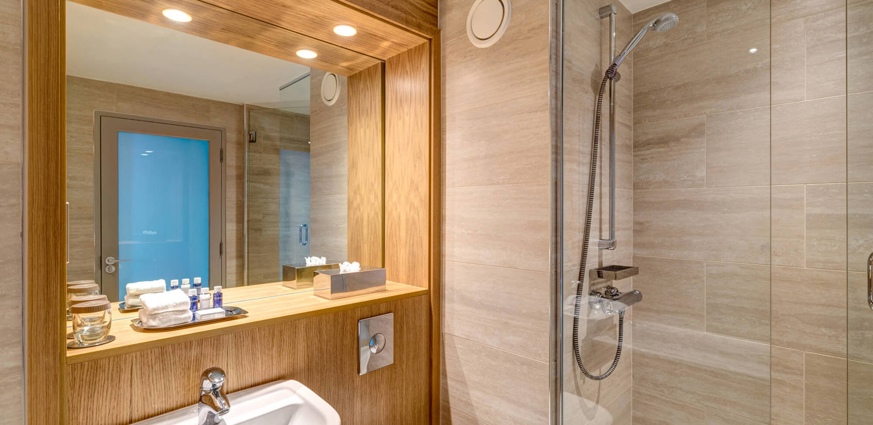 Family Room bathroom with walk-in shower at Apex City Quay Hotel & Spa