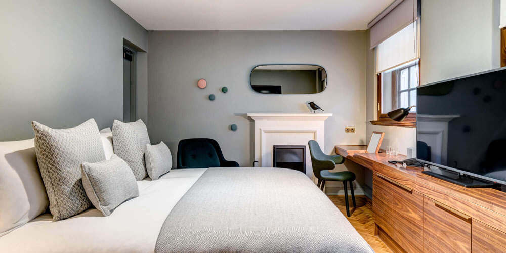 Temple Suite bedroom at Apex Temple Court Hotel