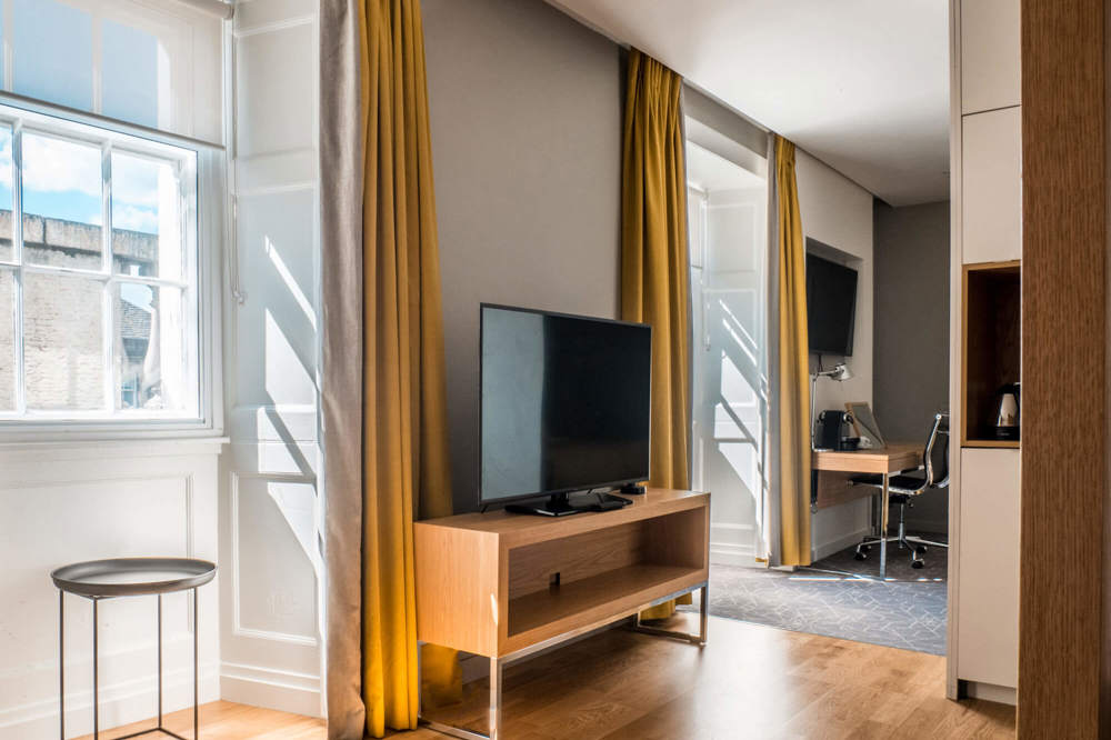 Master Suite with TV at Apex Waterloo Place Hotel