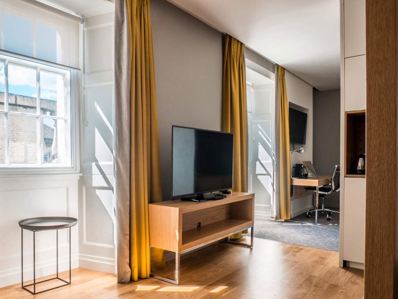 Master Suite TV and large windows at Apex Waterloo Place Hotel