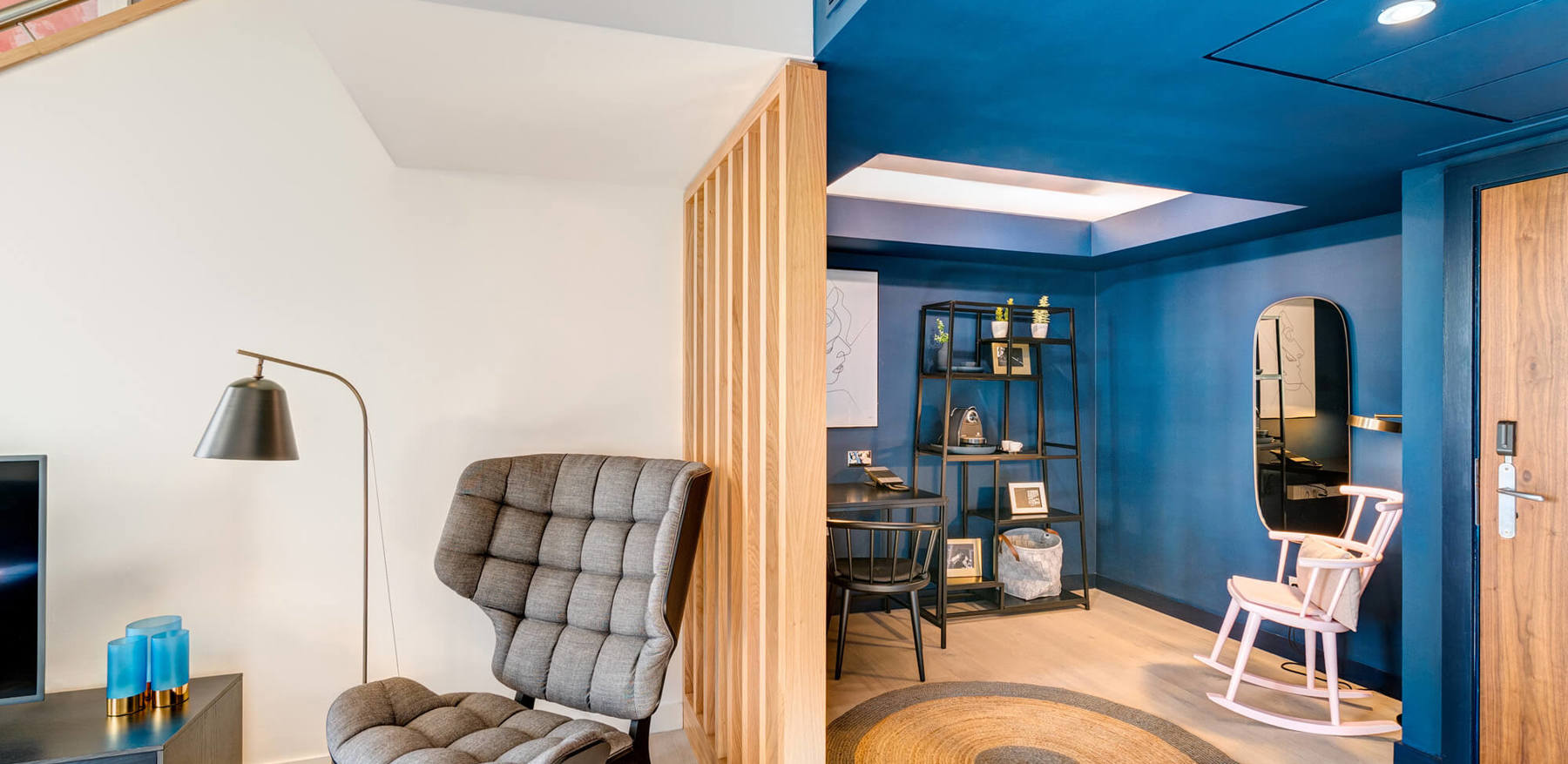 Duplex Suite living area with chair and desk at Apex Waterloo Place Hotel