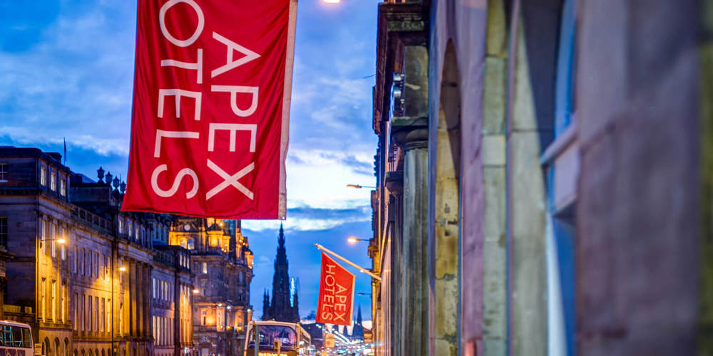 Exterior of Apex Waterloo Place Hotel with red Apex Hotels flag