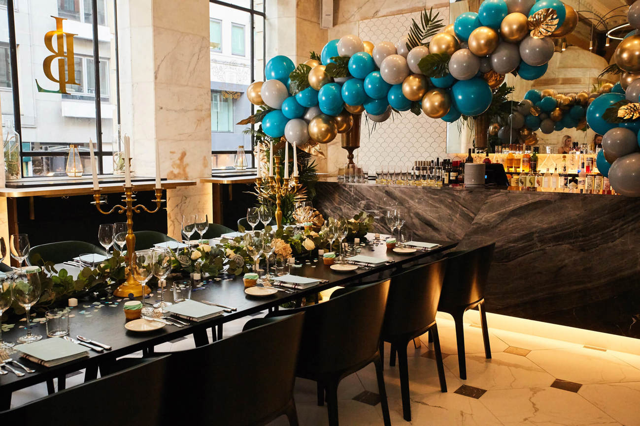 Lazy Ballerinas dressed for Swim Society event launch with balloon arch