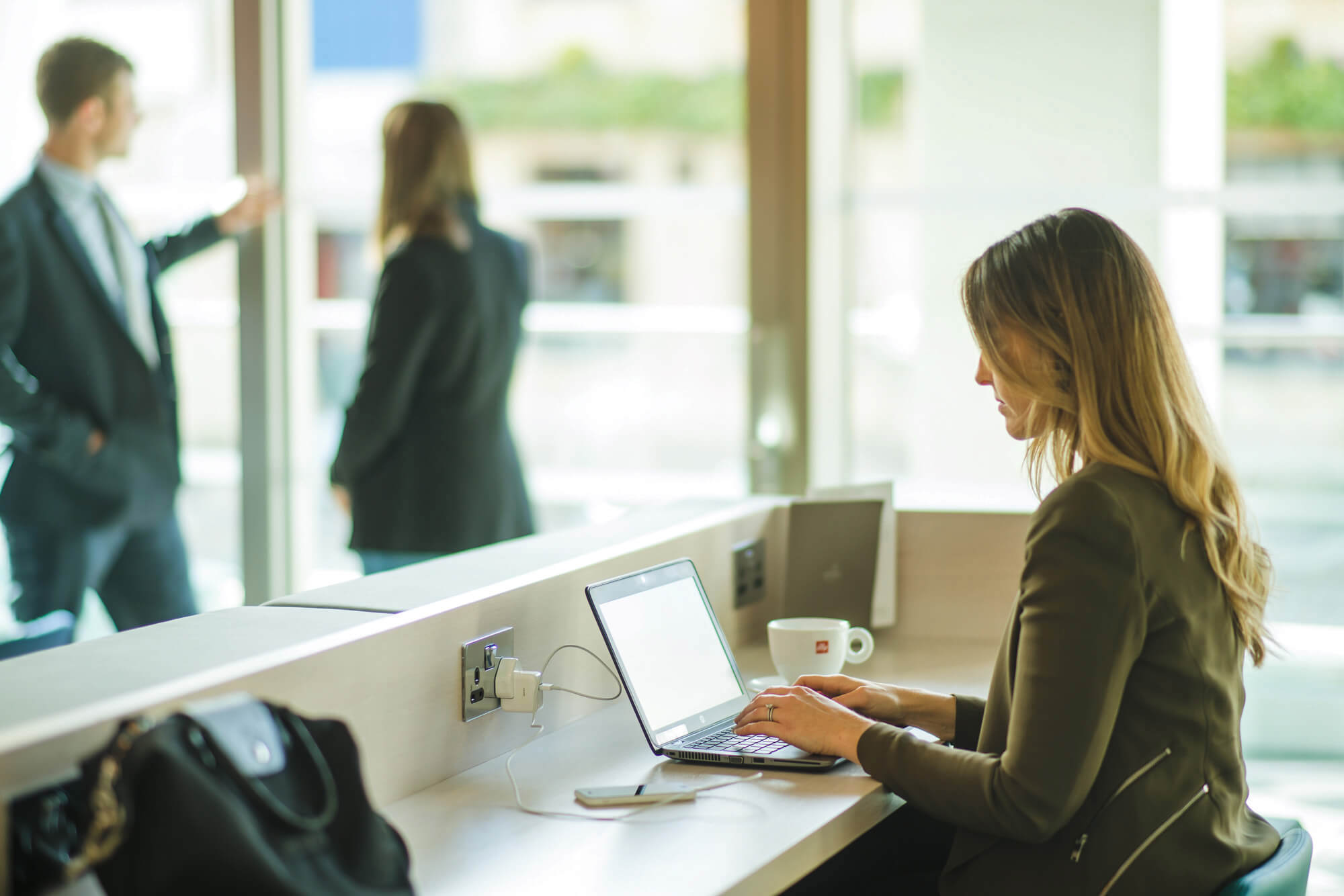 Guest working on laptop in open area