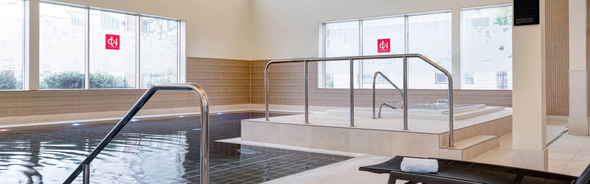 Yu Spa swimming pool with poolside loungers