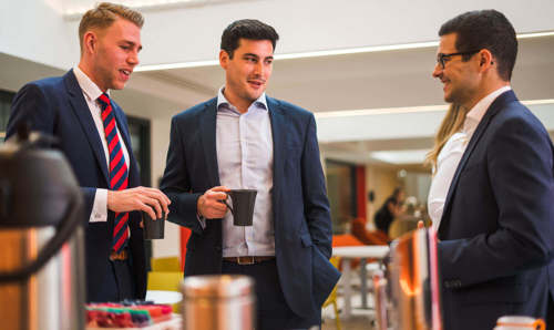 Colleagues chatting over coffee at Apex City of Bath Hotel