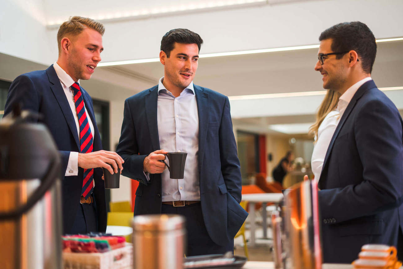 Colleagues chatting over coffee at Apex City of Bath Hotel