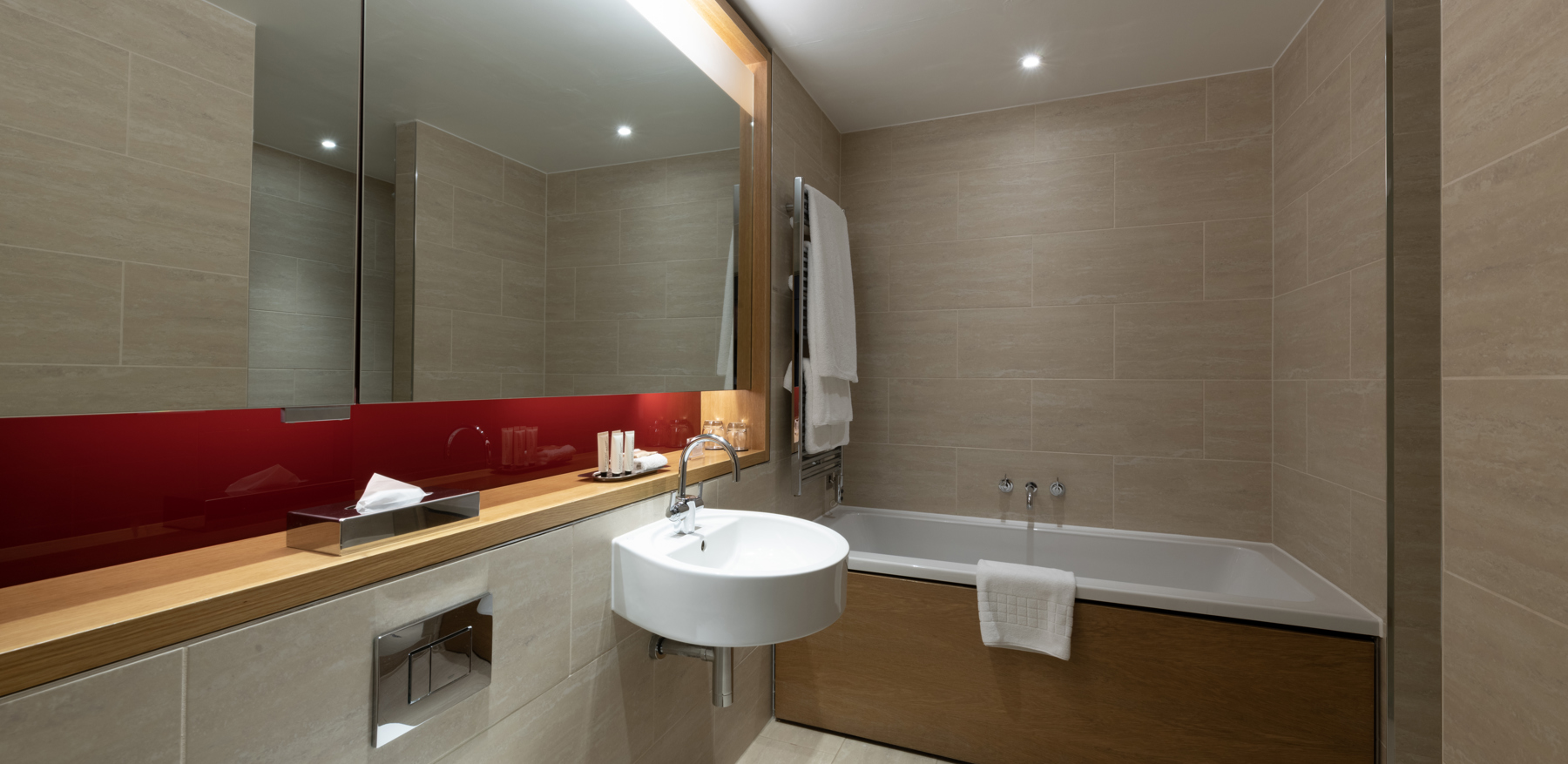 Deluxe Room bathroom with walk in shower at Apex Temple Court Hotel